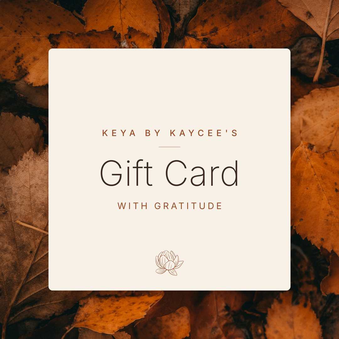 KEYA by Kaycee’s Thanksgiving gift card reading “Gift Card, With Gratitude” on an ivory panel framed by golden autumn leaves